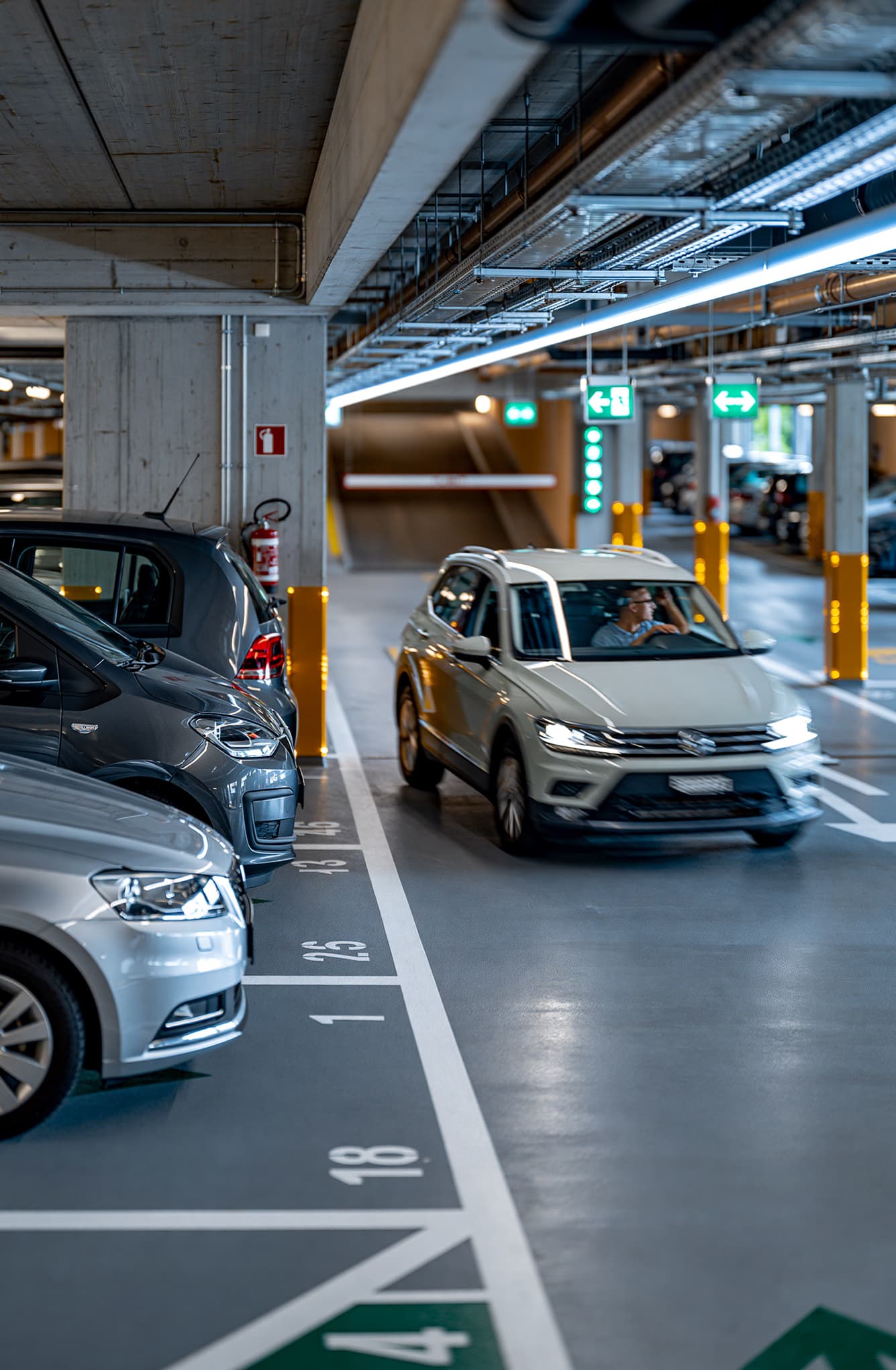 A blocked underground garage entrance with parked vehicles
